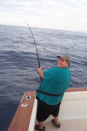 Bob Vanian hooked to am estimated 350 pound blue marlin off Barra Navidad aboard the Christina Lynn. It is early in the standup fight and the pain and exhaustion ahead has yet to set in (I am still smiling). Jan.2004