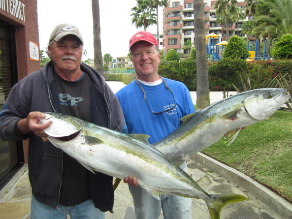 Private boater Mike Kraus of the Blackjack (right) with yellowtail caught while fishing out of Marina Coral