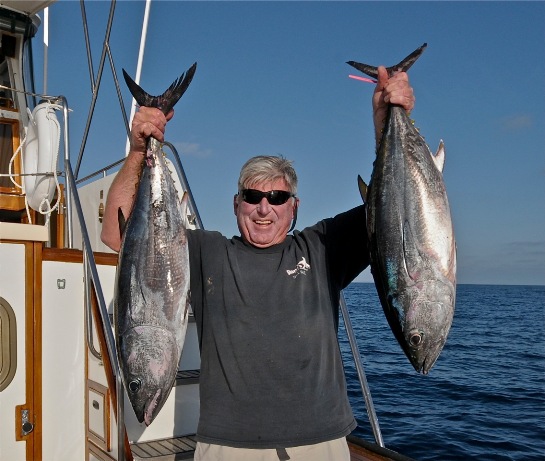 Carl Robbins hoisting a couple of nice  bluefin caught aboard the Christina Lynn on May 28, 2015